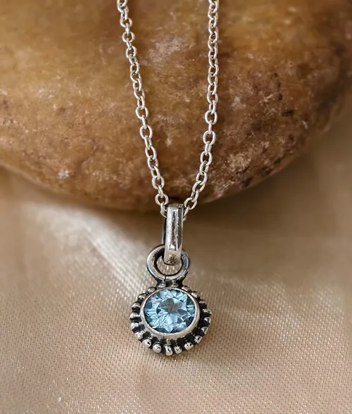 Blue Topaz Rawa Pendant - 925 Sterling Silver Gemstone Pendant 925 sterling silver blue topaz pendant with round cut gemstone and handcrafted rawa work border
